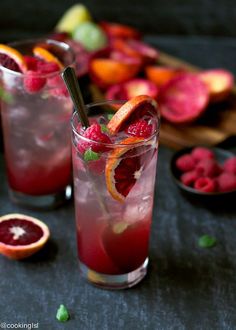 two glasses filled with blood orange and raspberry punch