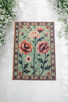 an area rug with flowers and leaves on it