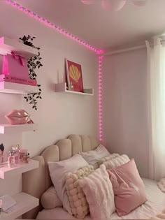 a bedroom with pink lights on the walls