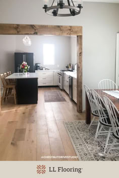 an open kitchen and dining room with wood flooring