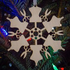 a wooden ornament hanging from a christmas tree