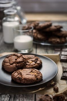 chocolate cookies and milk on a table