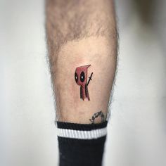 a small tattoo on the leg of a man