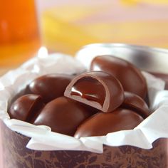 chocolate candies in a metal container on a table