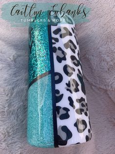 three different colored tubes with leopard print and blue glitter on the top, one is green