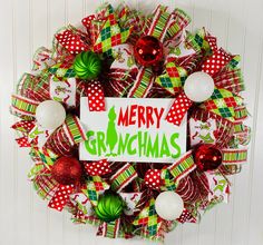 a christmas wreath with the words merry gravychmas on it and ornaments around it