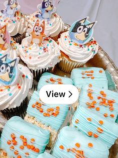 cupcakes with frosting and cartoon characters on them