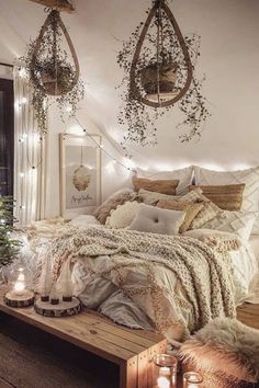 a bed room with a neatly made bed next to a christmas tree and some lights