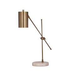 a brass and marble table lamp on a white base with a round light fixture in the middle