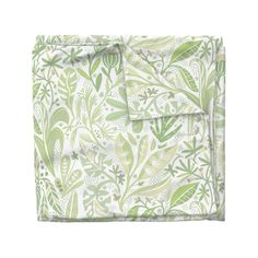 a green and white floral print sheet set