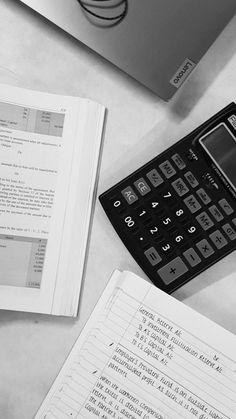 a calculator and some papers on a table