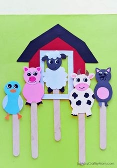 popsicle puppets with farm animals on them