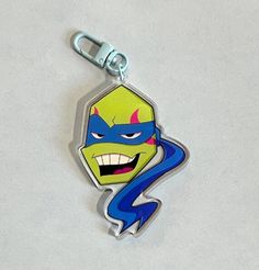 an image of a cartoon character keychain that is on display for people to see