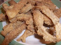 some fried food is on a green and white plate