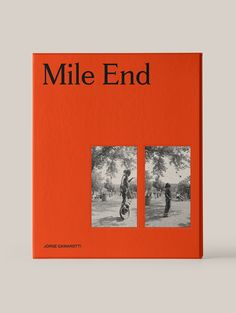 an orange book with black and white photos on it's cover, titled mile end