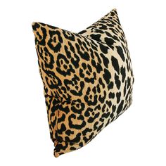 a leopard print pillow on a white background