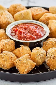 a platter with tater tots and dipping sauce