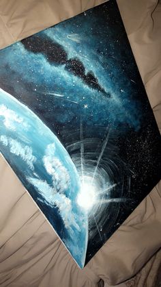 a painting of a space station with stars and clouds in the sky, on a white sheet