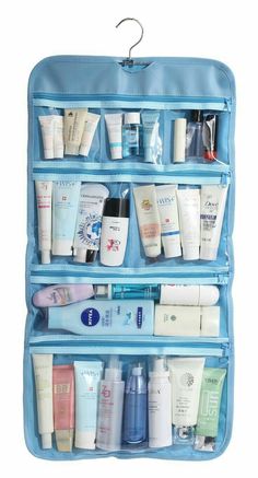 a blue hanging organizer filled with personal care products and hygiene items on it's side