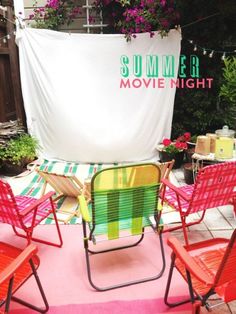 red and green lawn chairs sitting in front of a white backdrop with the words summer movie night on it