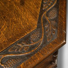 an old wooden table with carvings on it