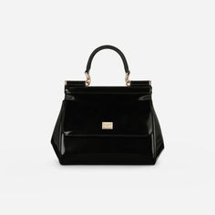 Elevate your style with the Sicily Medium Handbag in Glossy Black/Gold. Crafted from polished calfskin, this iconic bag exudes understated femininity. Complete with a logo tag featuring two metal plating finishes, it's perfect for any occasion. Make a statement with this luxurious and versatile handbag. Dolce And Gabbana Handbags, Medium Handbags, Iconic Bags, Logo Tag, Mini Wallet, Backpack Travel Bag, See By Chloe, Wallet Bag, A Logo