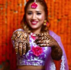 a woman with henna on her hands