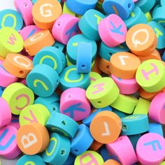 colorful plastic beads with numbers and letters on them