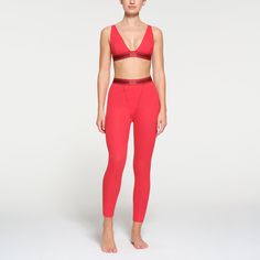 These cotton leggings hug the body yet allow your skin to breathe with cool and comfy natural fibers. The classic, rustic design elevates your lounge look. | SKIMS Legging | Red | Cotton Rib White Workout Outfit, Lounge Looks, Spring Forward, Ribbed Leggings, Cotton Leggings, Logo Label, Workout Outfit, Winter 2023, Rustic Design