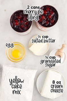 the ingredients to make cherry cheesecake are shown in separate bowls and labeled on plates