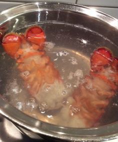 some food is being cooked in a pan on top of the stove and water running through it