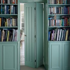 an open door leading to a library filled with books