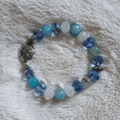 Handmade Crystal Blue Elastic Beaded Bracelet! Handmade By My Mom! Compared With A Regular Hair Tie For Size Reference! Best Fits S/M These Handmade Bracelets Carry The Care And Positive Energy Of Their Creator, Making Them A One-Of-A-Kind, Meaningful Accessory. Cute Extras Included With Every Purchase! Bundles Get Even More!! #Bracelet #Beads #Handmade #Crystals #Spiritual Iridescent Glowing Opalescent Handcrafted Vibrant Shimmering Suncatcher Dreamy Jewelry Light Blue Cerulean Opal Silver Acce Dreamy Jewelry, Girly Items, Crystal Blue, Brand Jewelry, Beads Handmade, Bracelet Ideas, Keep Jewelry, Bracelet Handmade, Silver Accents