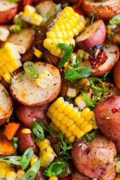 potatoes and corn on the cob are mixed together in this salad with herbs, seasoning, and pepper