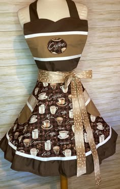 a coffee themed apron on a mannequin