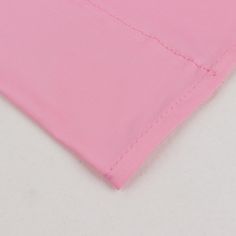 closeup of pink fabric with white background