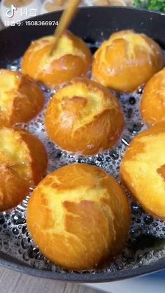 bread rolls being cooked in a frying pan