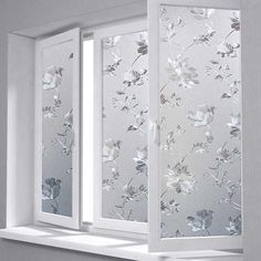 an open window with white flowers on it