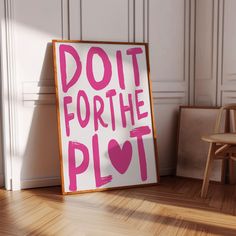 a sign that says do it for the plot next to a chair in a room