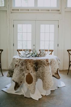 an image of a table setting for a wedding reception in the dining room at chevene johnson photography