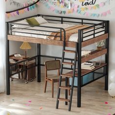 a loft bed with a desk underneath it and ladder to the upper level, in a room decorated with confetti streamers