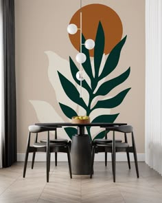 a dining room table with four chairs and a large wall mural behind it that has leaves on it