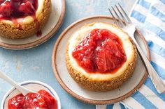 strawberry cheesecake on plate with fork next to it