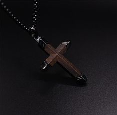 Elevate your style and showcase your faith with our stunning dark wooden cross necklaces for men. Crafted with meticulous attention to detail and using premium materials, our men's cross necklaces are the perfect combination of fashion and spirituality. Material: Top quality ebony wood + Stainless Steel. Pendant size: 1.26"(32mm) X 1.89"(48mm), Free 24" box chain Adjustable 56cm-61cm/22"-24" length High Quality Stainless Steel Cross Chain. WARNING: CHOKING HAZARD -- Small parts. Not for children Men's Cross Necklaces, Wooden Cross Necklace, Dark Necklace, Cross Necklace For Men, Cross Jewelry Necklace, Wooden Watches For Men, Mens Cross Necklace, Necklaces For Men, Cross Necklaces