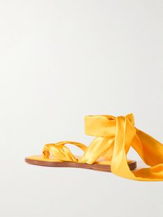 Christian Louboutin's 'Nilo du Desert' sandals are laced with bright yellow ties, crafted from smooth satin-crepe. They've been made in Italy with ribbon-inspired thong straps and rest on slight heels. Desert Sandals, Porter Bag, Latest Sandal, Summer Style Guide, Tie Sandals, Yellow Sandals, Flat Dress Shoes, Yellow Ties, Christian Louboutin Women