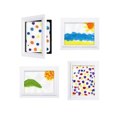 four framed art pieces with different shapes and colors are shown in white frames on the wall