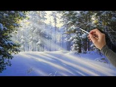 a painting of a person holding a paintbrush in front of a snowy landscape with trees