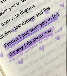 an open book with writing on it and some hearts drawn on the pages in purple ink