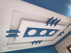 the ceiling is painted blue and white with circles, squares, and lines on it