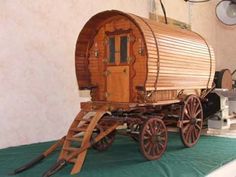 an old fashioned wooden wagon is on display